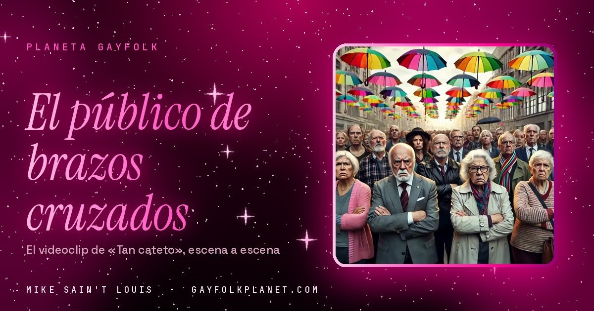 Fotograma del videoclip de «Tan cateto»: un grupo de personas mayores con gesto serio en una calle cubierta por paraguas de colores colgados en el aire